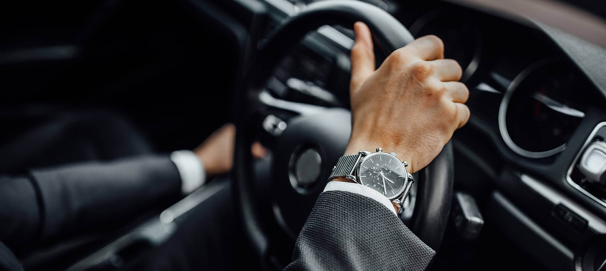 Chauffeur hands on steering wheel